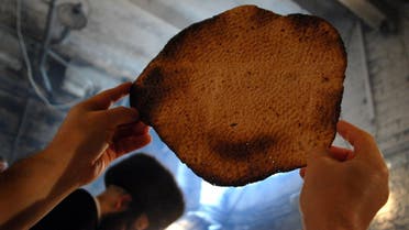 Members of the Hungarian Orthodox Jewish community are making Matzah; an unleavened bread for the Jewish holiday of Passover in the basement of their synagogue in Budapest, Hungary. (AP)