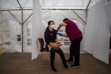 A nurse administers the Moderna COVID-19 vaccine at Kedren Community Health Center, in South Central Los Angeles, California on February 16, 2021. (Apu Gomes/AFP)