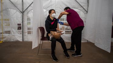 A nurse administers the Moderna COVID-19 vaccine at Kedren Community Health Center, in South Central Los Angeles, California on February 16, 2021. (Apu Gomes/AFP)