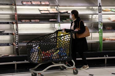 A shopper walks past near-empty shelves at a supermarket in Beirut, Lebanon March 16, 2021. Picture taken March 16, 2021. (Reuters)