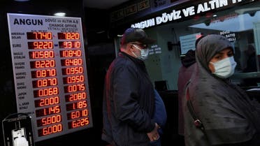 People wait to change money at a currency exchange office in Istanbul, Turkey, on March 22, 2021. (Reuters)
