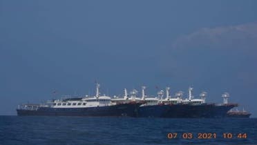 Some of the about 220 Chinese vessels reported by the Philippine Coast Guard, and believed to be manned by Chinese maritime militia personnel, are pictured at Whitsun Reef, South China Sea, March 7, 2021. Picture taken March 7, 2021. (Reuters)