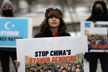 تجمعی در اعتراض به رفتار چین علیه مردم اویغور، روبروی سفارت کانادا در واشنگتن  19 فوریه 2021 (عکس رویترز)