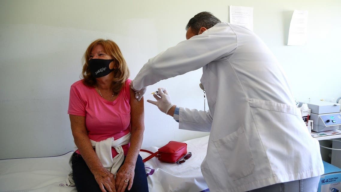 Susan Janet Crouch, a 71-year old woman from Britain living in Turkey, receives the first dose of Sinovac's CoronaVac coronavirus vaccine at a healthcare center in the Mediterranean town of Side, in Antalya province, Turkey March 4, 2021. (Reuters/Kaan Soyturk)