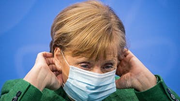 German Chancellor Angela Merkel holds her mask during a news conference after a meeting with state leaders to discuss options beyond the end of the pandemic lockdown, amid the outbreak of the coronavirus disease (COVID-19), in Berlin, Germany, March 23, 2021. (File photo: Reuetrs)