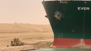 A container ship ran aground in the Suez Canal, blocking vessels passing through. (Twitter)