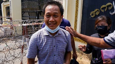Associated Press (AP) photographer Thein Zaw smiles outside Insein prison in Yangon on March 24, 2021, after being released with coup detainees who had been held for taking part in demonstrations against the military coup. (AFP)