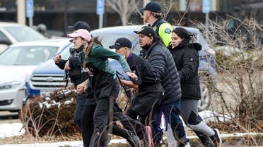 King Soopers employees are led away from an active shooter at the King Soopers grocery store in Colorado, March 22. 2021. (Reuters)