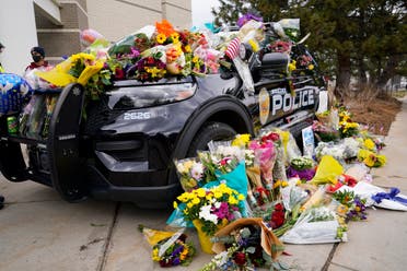 Police cruiser parked outside Boulder Police Department is covered with bouquets in tribute after an officer was one of the victims of a mass shooting at a King Soopers grocery store Tuesday, March 23, 2021, in Boulder, Colo. (File photo: AP)