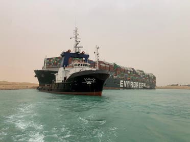 A container ship which was hit by strong wind and ran aground is pictured in Suez Canal, Egypt, on March 24, 2021. (Reuters)