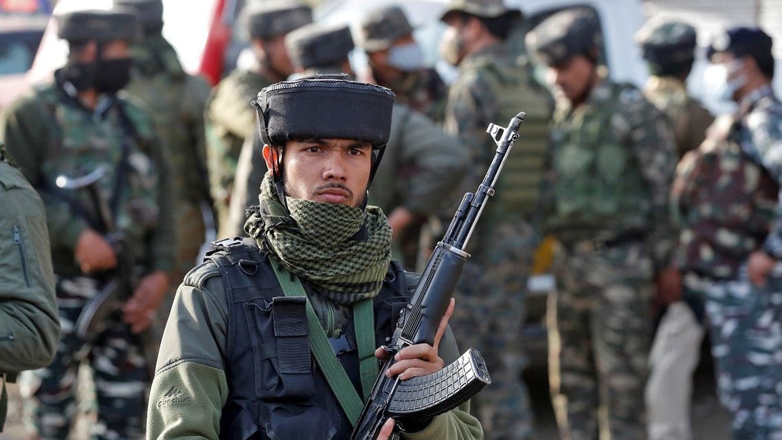 India’s security force personnel stand guard at the site of an attack on Central Reserve Police Force (CRPF) troopers by suspected militants on the outskirts of Srinagar, on March 25, 2021. (Reuters)