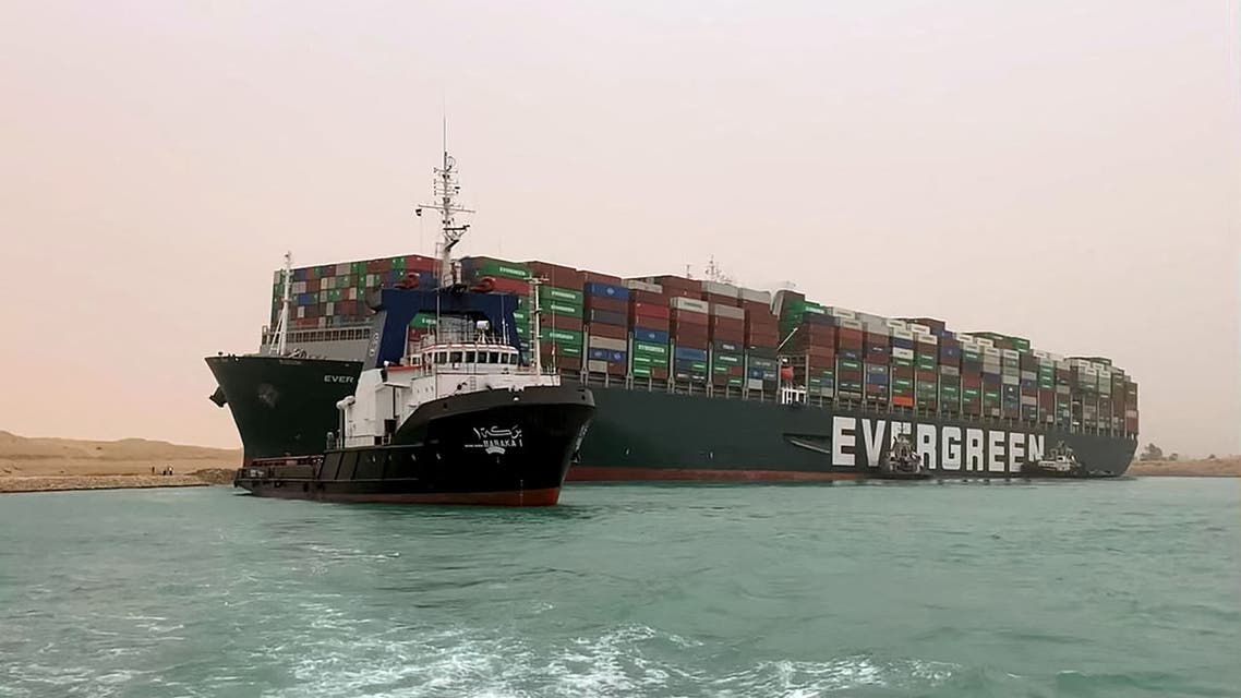 The Taiwan-owned MV Ever Given (Evergreen), a 400-meter- (1,300-foot-) long and 59-meter wide vessel, lodged sideways and impeding all traffic across the waterway of Egypt's Suez Canal. (AFP)