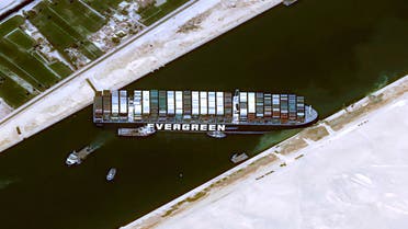 This handout satellite images courtesy of Cnes 2020 released on March 25, 2021 by Airbus DS shows the Taiwan-owned MV 'Ever Given' (Evergreen) container ship, a 400-metre- (1,300-foot-)long and 59-metre wide vessel, lodged sideways and impeding all traffic across the waterway of Egypt's Suez Canal. The owners of a giant container vessel blocking the Suez Canal said they faced extreme difficulty refloating it as Egypt temporarily closed one of the world's busiest shipping lanes. CNES / AFP