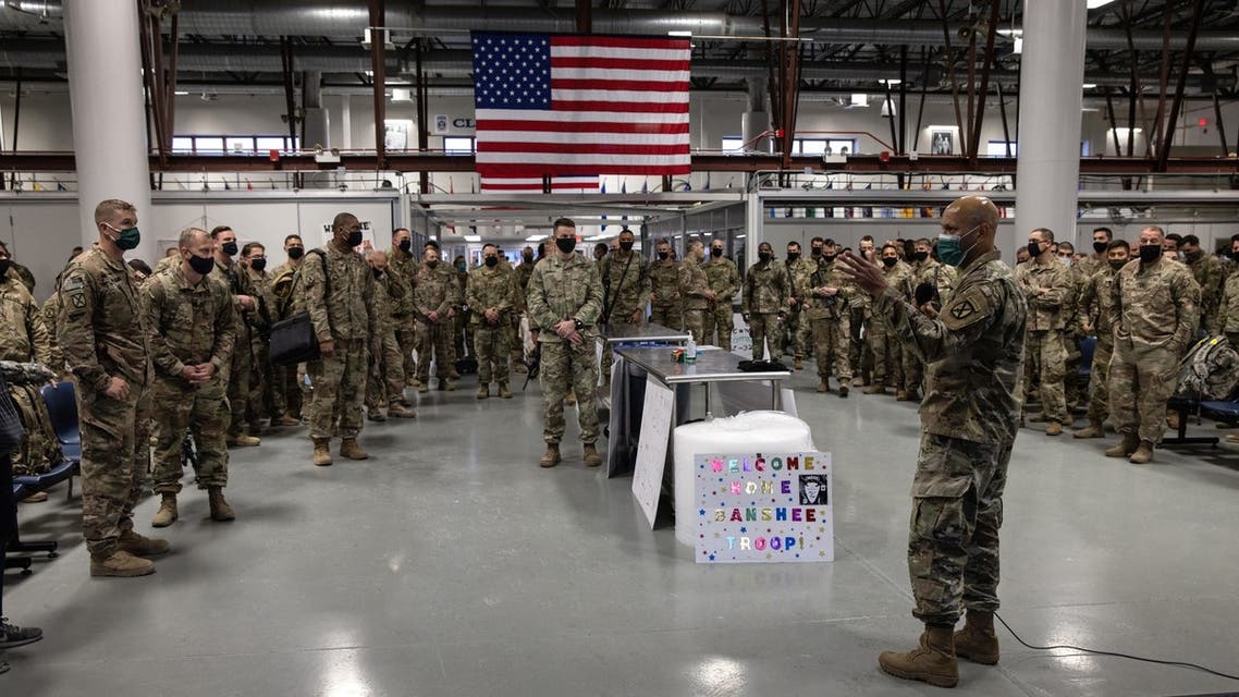 FORT DRUM, NEW YORK - DECEMBER 10: U.S. Army soldiers are briefed on COVID-19 quarantine procedures after returning home from a 9-month deployment to Afghanistan on December 10, 2020 at Fort Drum, New York. The 10th Mountain Division soldiers who arrived this week are under orders to isolate at home or in barracks, finishing their quarantine just before Christmas. The troops were replaced in Afghanistan by a smaller force, as the U.S. military continues to reduce troop levels Afghanistan. John Moore/Getty Images/AFP