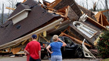 Residents survey damage to homes after a tornado touched down south of Birmingham, Ala. in the Eagle Point community damaging multiple homes, Thursday, March 25, 2021. (AP)