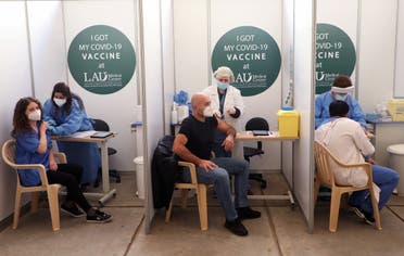 People receive a Pfizer/BioNTech COVID-19 vaccine dose during a coronavirus vaccination campaign at Lebanese American University Medical Center-Rizk Hospital in Beirut, Lebanon February 16, 2021. (Reuters)
