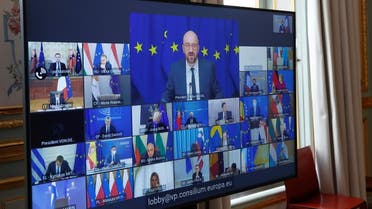 European Council President Charles Michel speaks during an EU summit video conference, as seen on screen at the Elysee Palace in Paris, France. (Reuters)