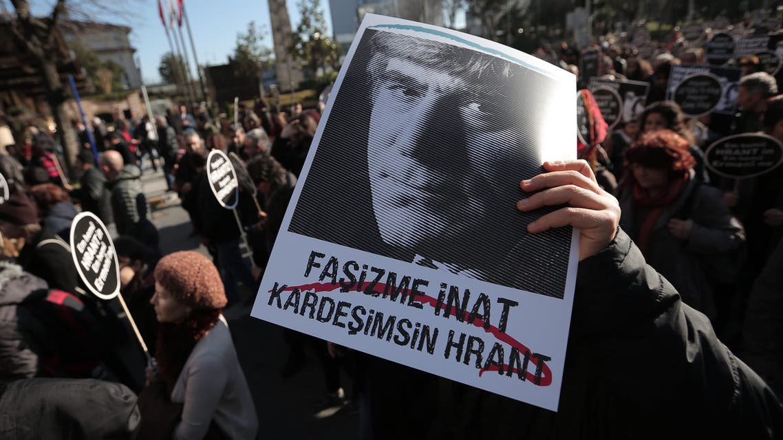 Thousands of protesters gather outside the Agos newspaper in Istanbul, Turkey, Monday, Jan. 19, 2015 to mark the eighth anniversary of Turkish-Armenian journalist Hrant Dink's murder. (AP)