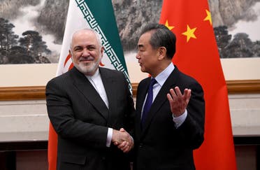 China’s Foreign Minister Wang Yi shakes hands with Iran’s Foreign Minister Mohammad Javad Zarif during a meeting at the Diaoyutai state guest house in Beijing, China, on December 31, 2019. (File photo: Reuters)