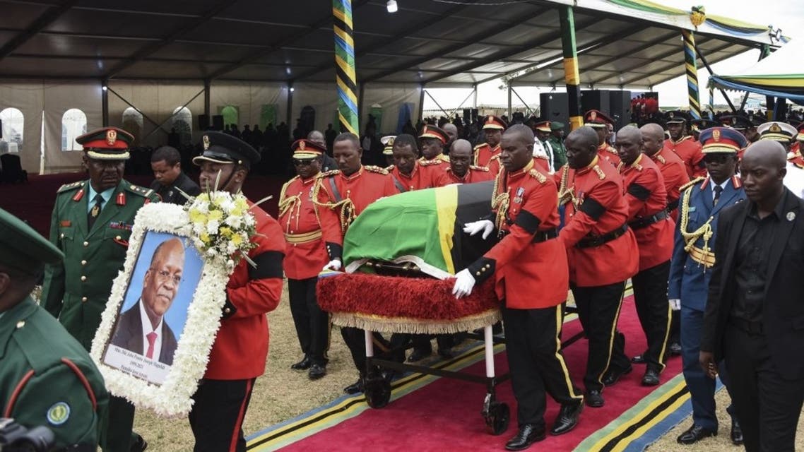 Personnel of the Tanzania People's Defence Force (TPDF) move the coffin of the late Tanzanian President John Magufuli for the burial after the farewell mass at Magufuli Stadium in Chato, Tanzania, on March 26, 2021. (AFP)