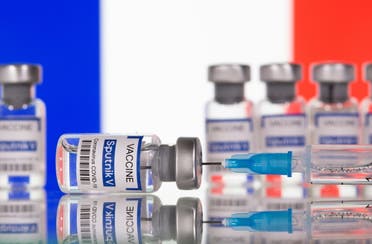 Vials labelled Sputnik V Coronavirus COVID-19 Vaccine and a syringe are seen in front of a displayed French flag, in this illustration photo taken March 12, 2021. (File photo: Reuters)