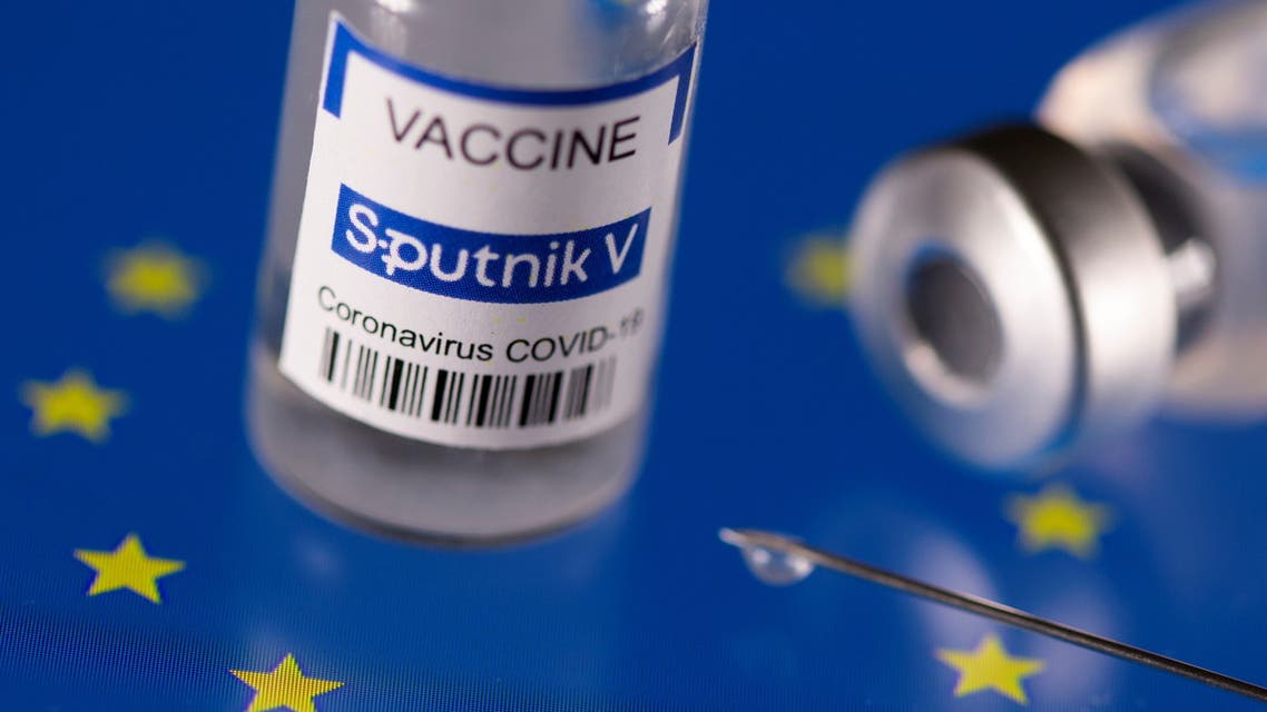 Vials labelled Sputnik V coronavirus disease (COVID-19) vaccine placed on displayed EU flag are seen in this illustration picture taken March 24, 2021. REUTERS/Dado Ruvic/Illustration