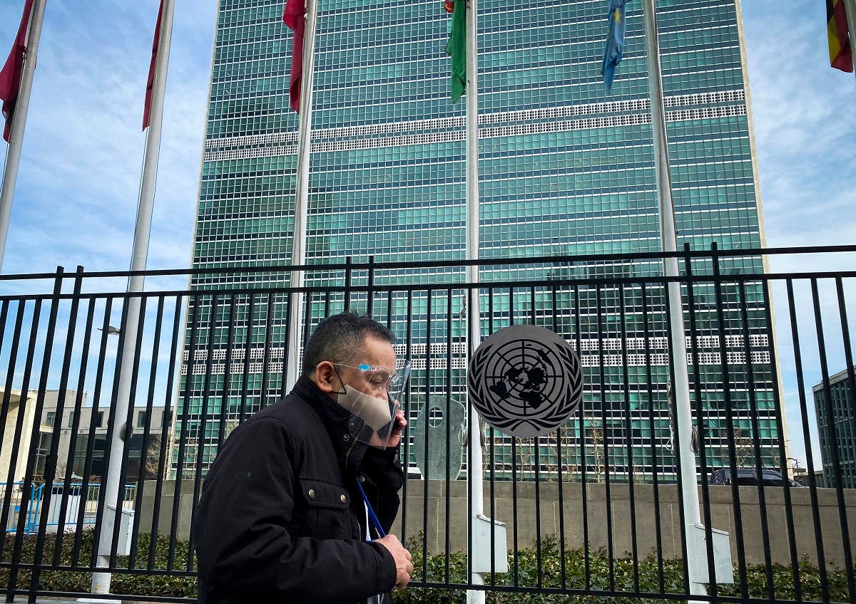 A man walks past the United Nations headquarters in New York on March 11, 2021, one year after the pandemic was officially declared. (AFP)