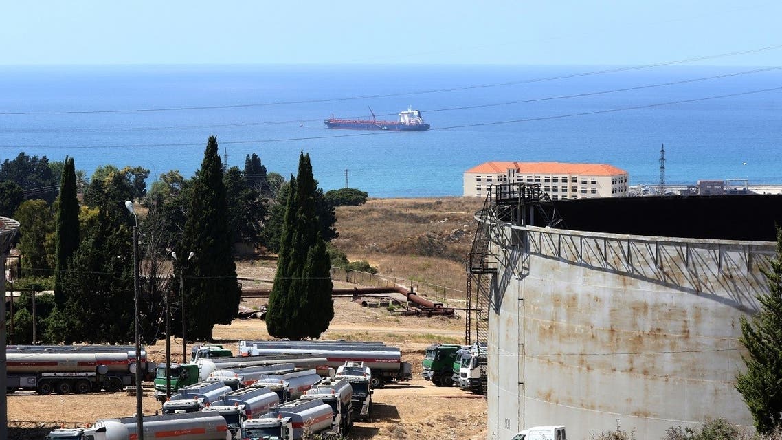 Tanker trucks filled with fuel offered by Iraq wait to empty their content at the oil refinery of Zahrani, near the southerm Lebanese city of Sidon (Saida) on August 20, 2020. (AFP)