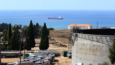 Tanker trucks filled with fuel offered by Iraq wait to empty their content at the oil refinery of Zahrani, near the southerm Lebanese city of Sidon (Saida) on August 20, 2020. (AFP)
