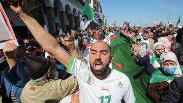 A demonstrator gestures during a protest demanding political change, in Algiers. (Reuters)