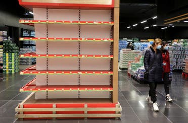 Shoppers walk past an empty shelf at a supermarket in Beirut, Lebanon March 16, 2021. Picture taken March 16, 2021. (File photo: Reuters)