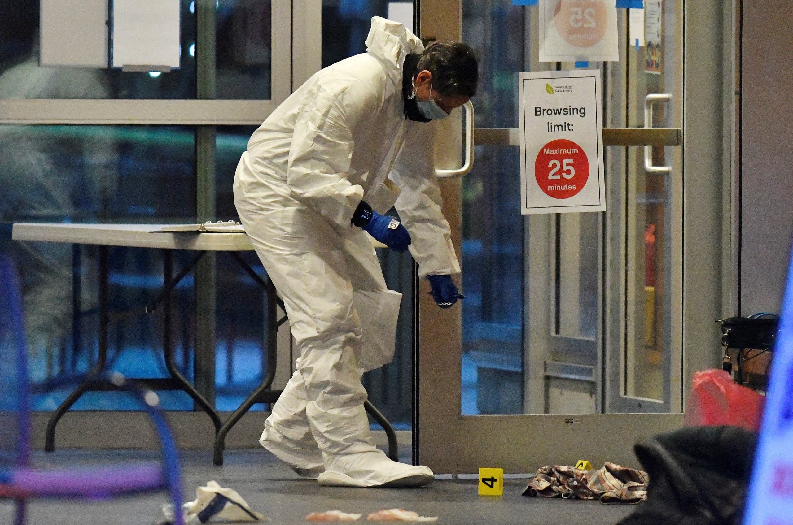 A first responder works at a crime scene where police say multiple people were stabbed by a suspect at a Vancouver Library in Canada. (Reuters)