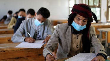 High school students wear protective face masks as they attend final exams amid concerns of the spread of the coronavirus disease (COVID-19) in Sanaa, Yemen. (Reuters)