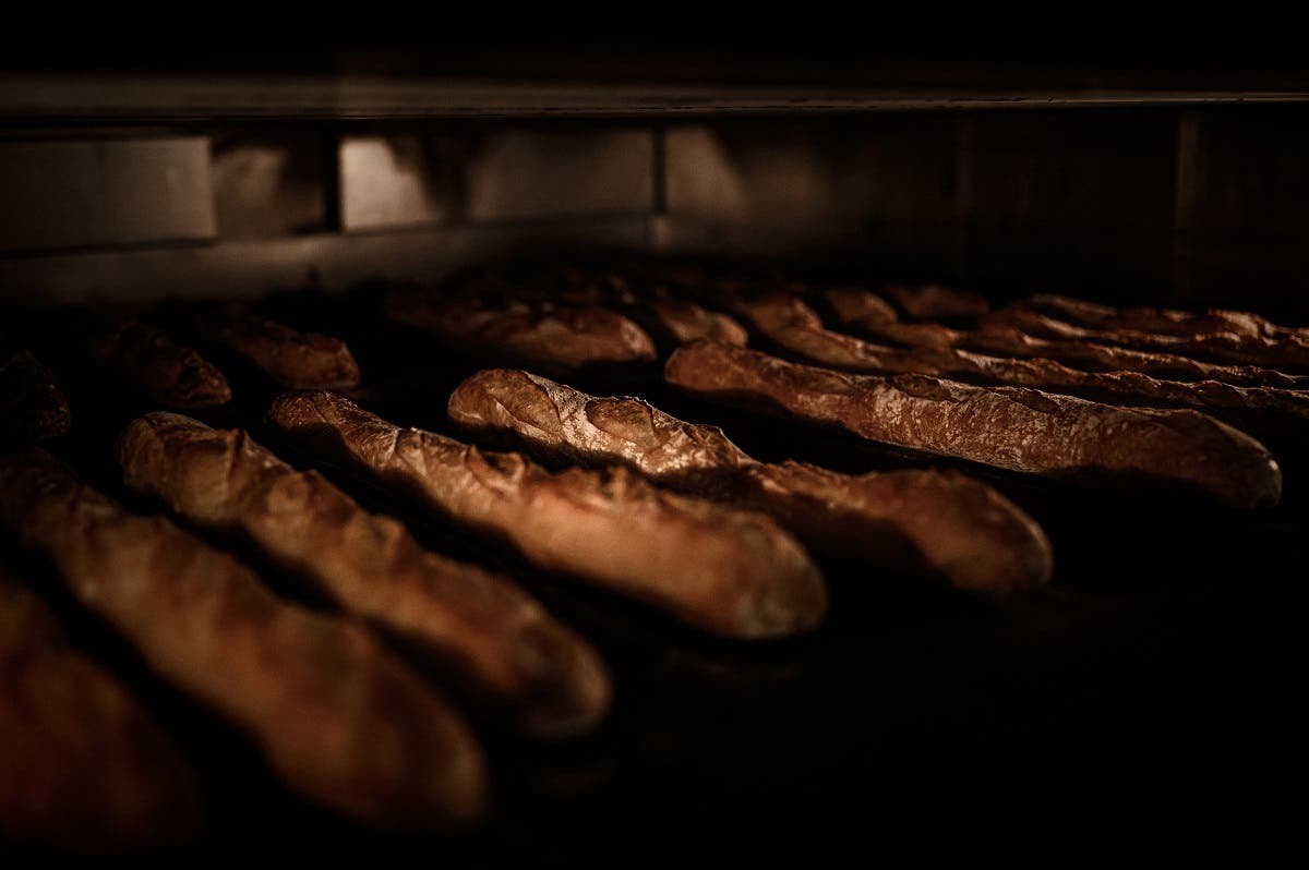 This file photo taken on January 8, 2020 shows freshly baked baguettes in a bakery in Paris. France decided on March 26, 2021 to present the candidacy of the baguette de pain bread for inscription at Unesco's Lists of Intangible Cultural Heritage. (AFP)