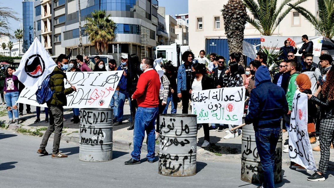 Supporters of Tunisian non-governmental organizations demonstrate to demand the return to Italy of household waste exported Illegally to the country, in the Mediterranean port city of Sousse, on March 28, 2021. (Bechir Taieb/AFP)