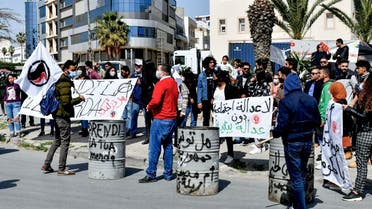 Supporters of Tunisian non-governmental organizations demonstrate to demand the return to Italy of household waste exported Illegally to the country, in the Mediterranean port city of Sousse, on March 28, 2021. (Bechir Taieb/AFP)