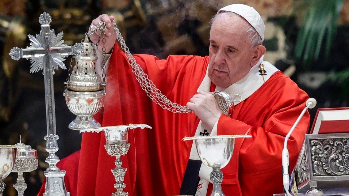 Pope Francis swings a thurible of incense around the altar as he celebrates Palm Sunday mass on March 28, 2021 in The Vatican, amid the coronavirus COVID-19 pandemic. (Giuseppe Lami/Pool/AFP)