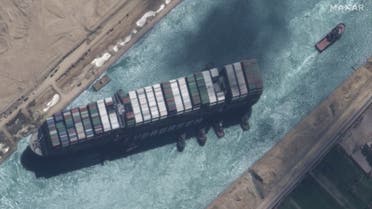 This satellite imagery released by Maxar Technologies shows a close up overview of the MV Ever Given container ship and tugboats in the Suez Canal on March 29, 2021. (AFP)