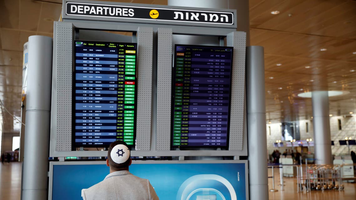 A man looks at a flight information board in the departures terminal at Ben Gurion International airport in Lod, near Tel Aviv, Israel March 10, 2020. (Reuters)
