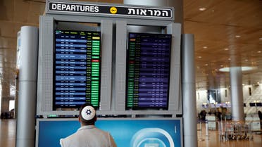 A man looks at a flight information board in the departures terminal at Ben Gurion International airport in Lod, near Tel Aviv, Israel March 10, 2020. (Reuters)