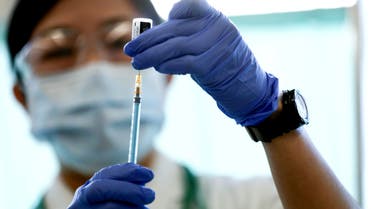 A medical worker fills a syringe with a dose of the Pfizer-BioNTech coronavirus disease (COVID-19) vaccine as Japan launches its inoculation campaign, at Tokyo Medical Center in Tokyo, Japan February 17, 2021. (File photo: Reuters)