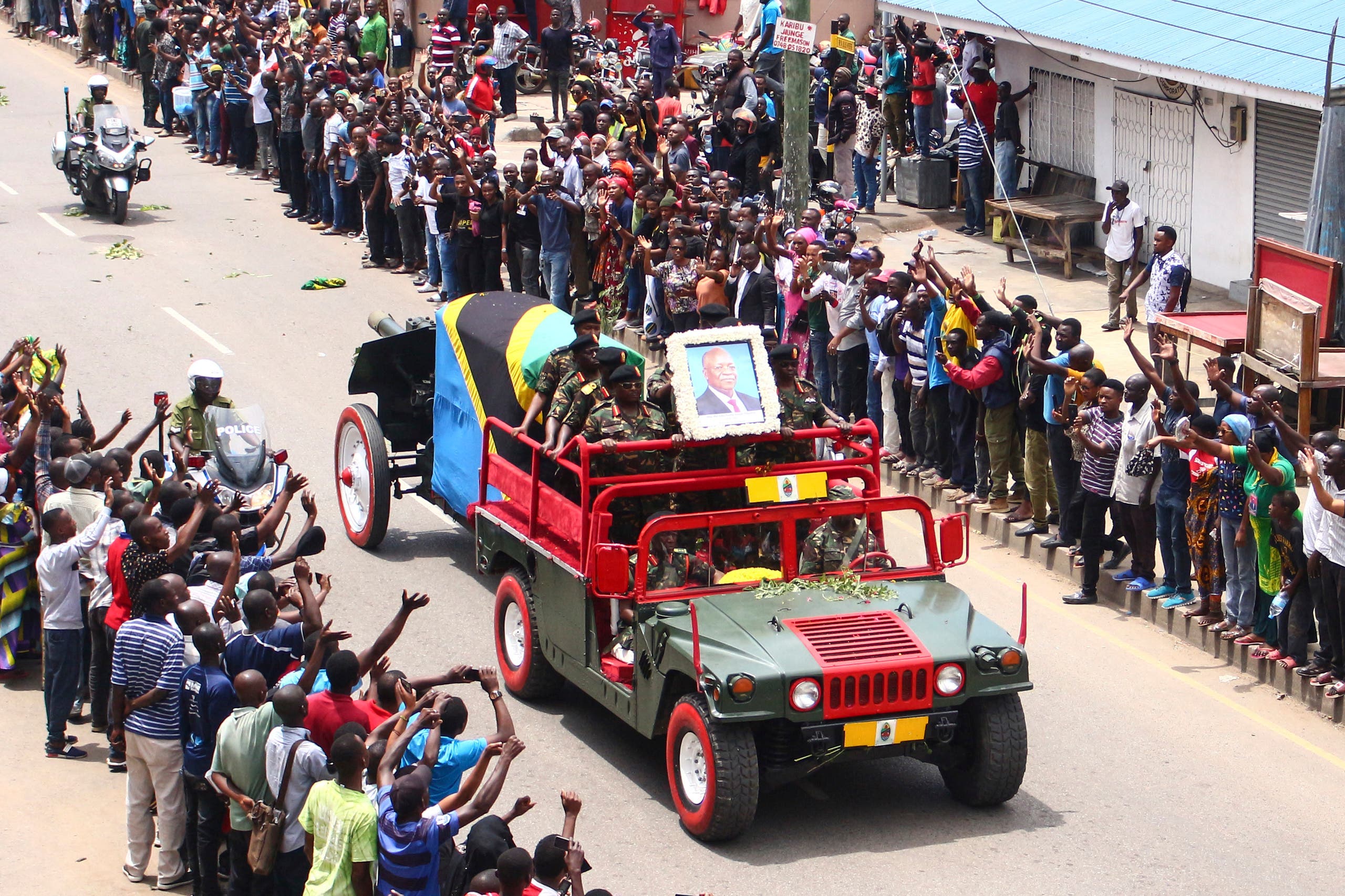 The coffin of the late Tanzanian President John Magufuli passes on a road for his funeral in Mwanza, Tanzania, on March 24, 2021. (AFP)