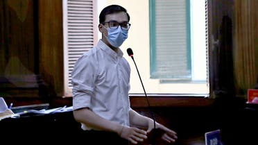 Vietnam Airlines flight attendant Duong Tan Hau, addresses the court before being found guilty of violating COVID-19 quarantine rules and handed a two year suspended prison term in Ho Chi Minh City, Vietnam March 30, 2021. VNA via REUTERS THIS IMAGE HAS BEEN SUPPLIED BY A THIRD PARTY. NO RESALES. NO ARCHIVES