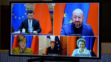 European Commission President Ursula von der Leyen, European Council President Charles Michel, German Chancellor Angela Merkel, French President Emmanuel Macron and Chinese President Xi Jinping are seen on a screen during a video conference, in Brussels, Belgium, on December 30, 2020. (Reuters)