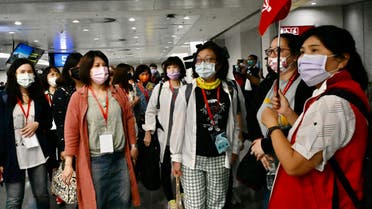 Taiwan tourists arrive at Taoyuan International Airport near Taipei on April 1, 2021, before heading to Palau as part of a travel bubble plan. (File photo: AFP)