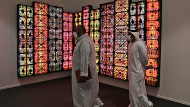 People visit Saudi artist Rashed Al Shashai's work titled Brand 14, Light Boxes, Plastic Cases, at the 14th edition of Art Dubai at Dubai International Financial Centre, DIFC, which features 50 galleries from 31 countries with a focus on modern and contemporary art, in Dubai, United Arab Emirates, Tuesday, March 30, 2021. (File photo: AP)
