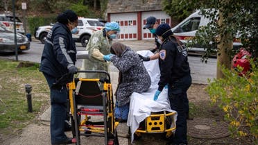 Empress EMS paramedics transport a patient with COVID-19 symptoms to a hospital on April 17, 2020 in Yonkers, New York. (AFP)