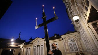 Christians mark Good Friday as holy sites gradually reopen