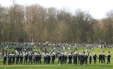 Belgian police forces dispersing young people gathering at the Bois de la Cambre/Ter Kamerenbos park in Brussels, Belgium, on April 1, 2021. (Reuters)