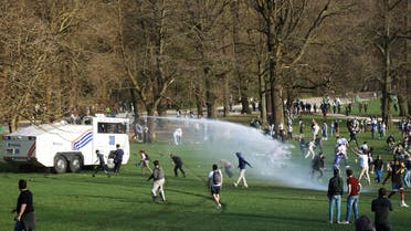 Belgian police forces disperse young people gathering at the Bois de la Cambre/Ter Kamerenbos park for a party in defiance of Belgium's coronavirus disease (COVID-19) social distancing measures and restrictions, in Brussels, Belgium, on April 1, 2021. (Reuters)